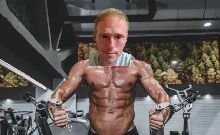 Dan, flexing some muscle at gym