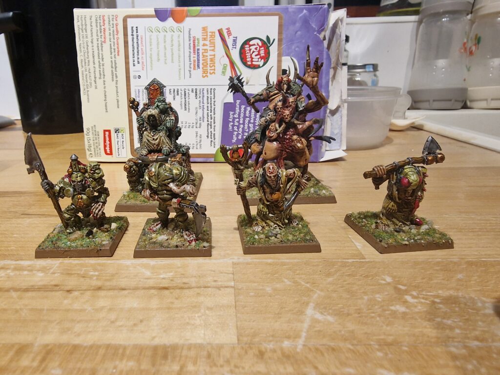 Converted chaos lord in the background, the rest of the characters from the army are old school chaos champions